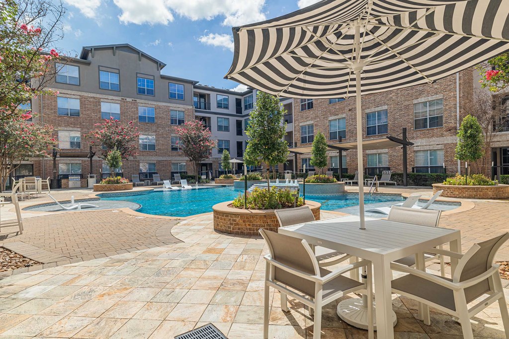 Sundeck near pool at Auxo at Memorial, Houston, TX