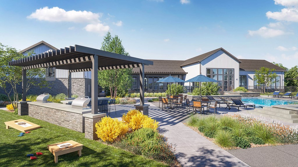 a patio area with a pool and patio furniture