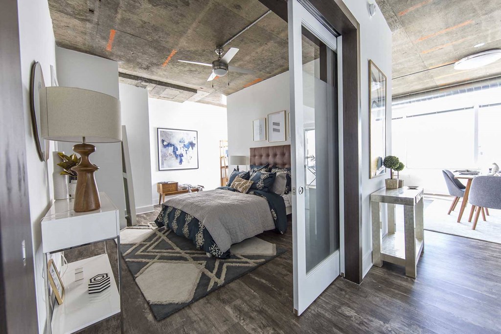 a bedroom with a bed and a closet