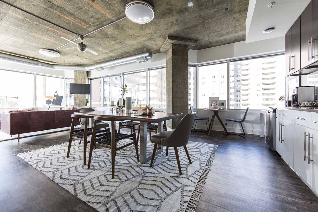 a dining room and kitchen in a loft apartment