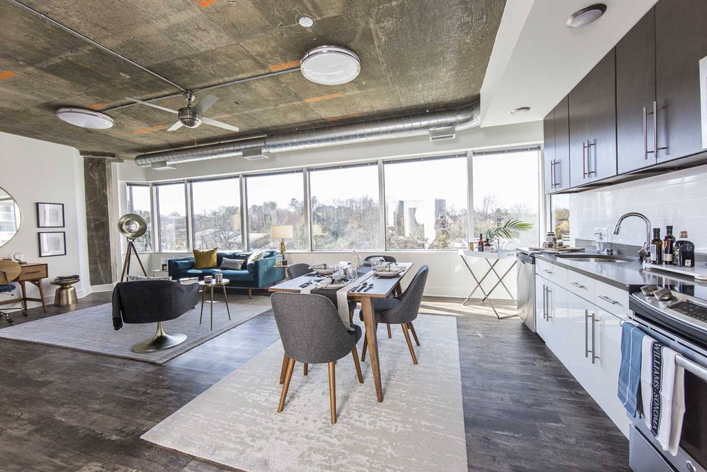 a kitchen and living room in a loft