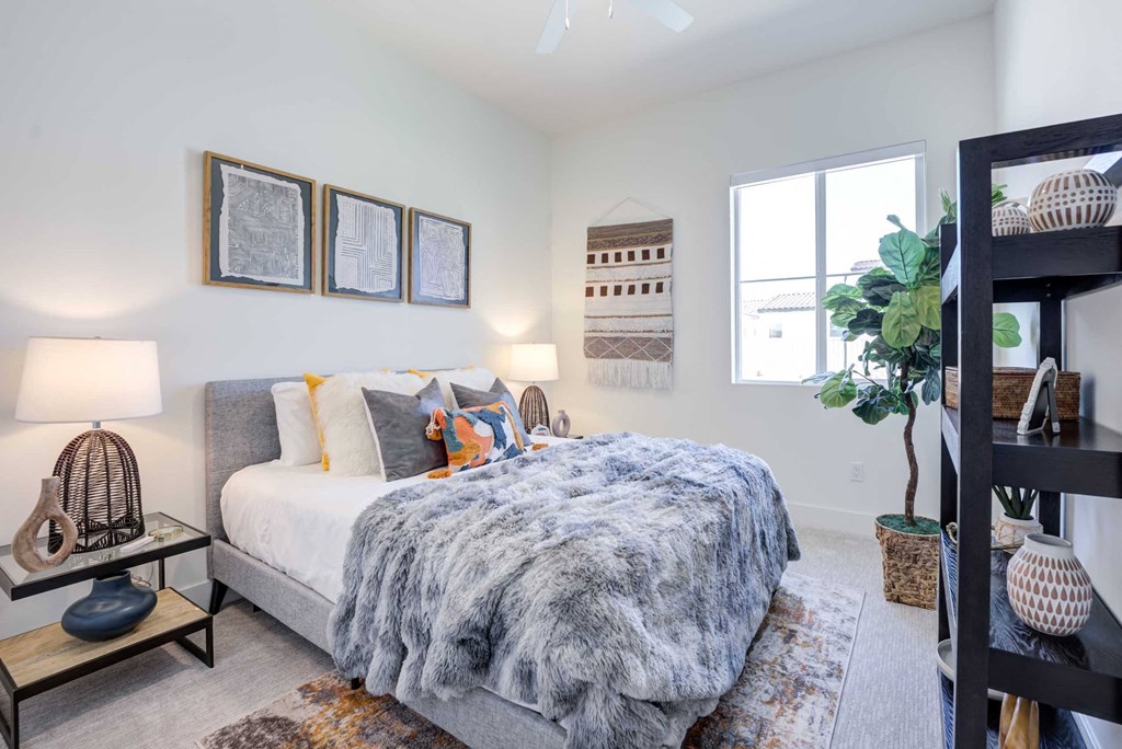 a bedroom with a bed and a window