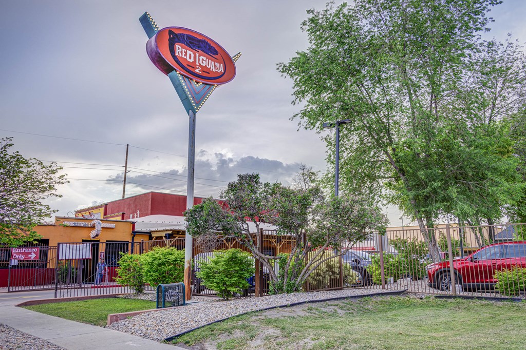 a sign for a frito lay restaurant in front of a building