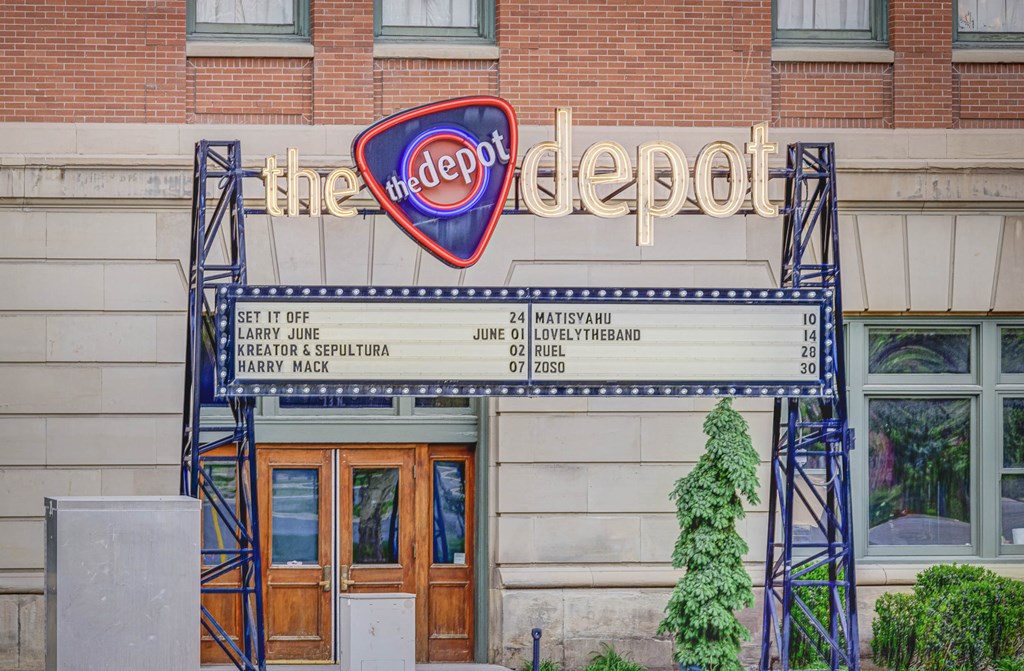 the neon sign outside of the reopened factory