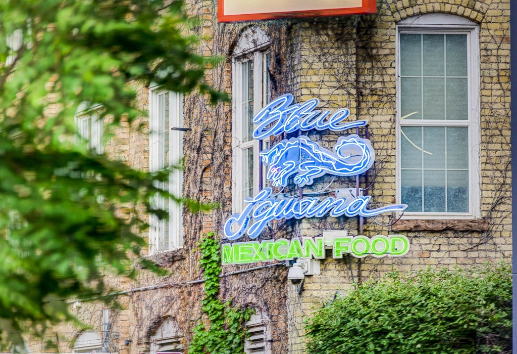 a neon sign on the side of a building