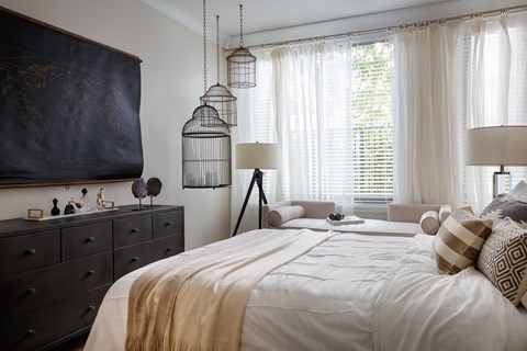 Bedroom with bed and oversized window at Grey House, Houston, 77027