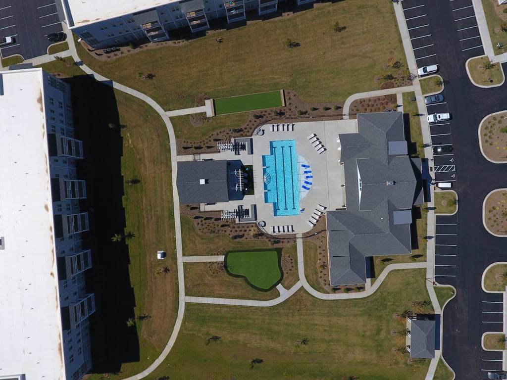 an overhead view of a swimming pool on the side of a building