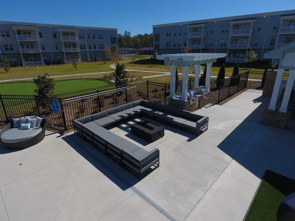 a fire pit and seating area in the middle of a building