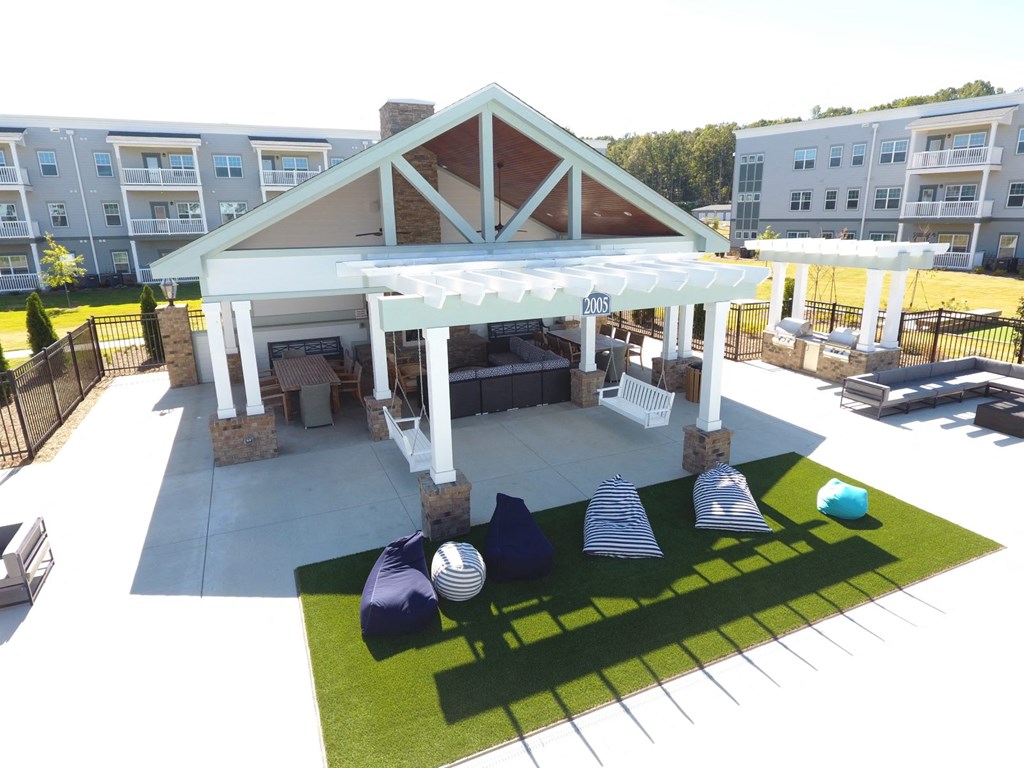 an overhead view of a pavilion with lounge furniture in an apartment complex