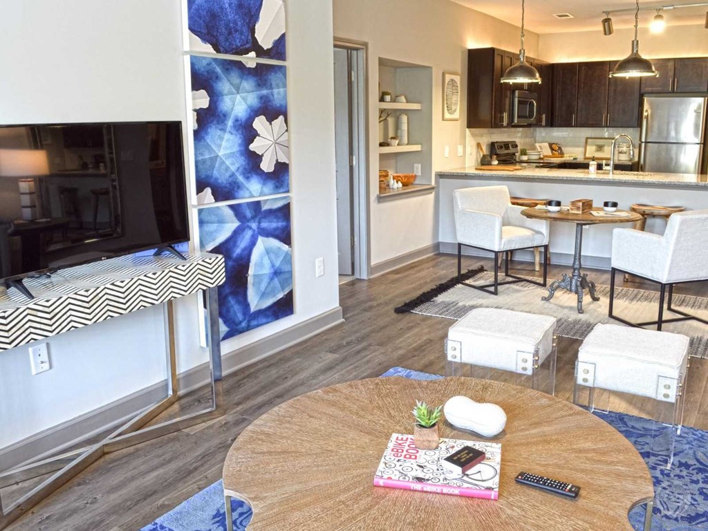 a living room with a table and a television