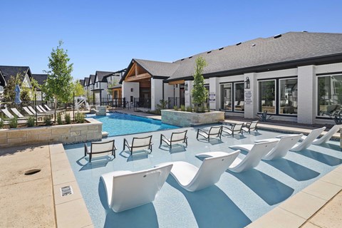 Lounge chairs by the pool at Emerson at Trace, Texas