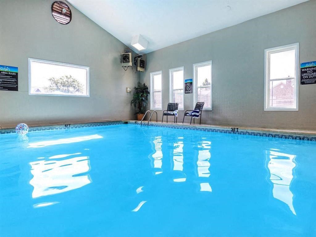 a swimming pool in a hotel with a blue water