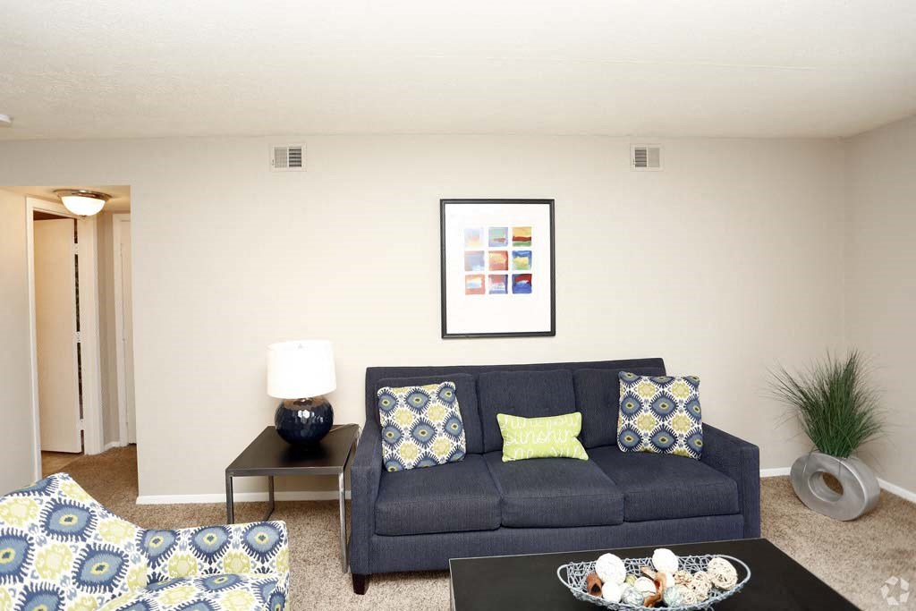 a living room with a couch and a table