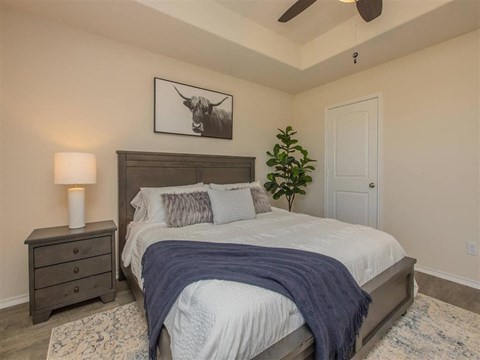 Bedroom with bed and nightstand at The Village at Granger Pines, Conroe, 77302