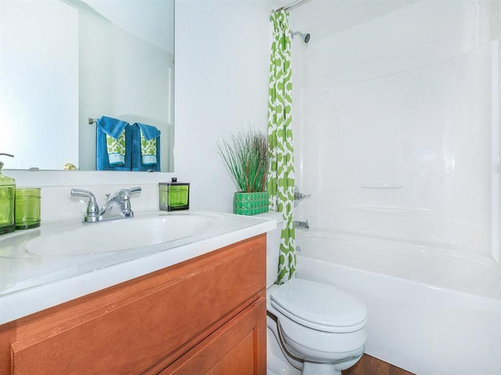 a bathroom with a sink toilet and a shower