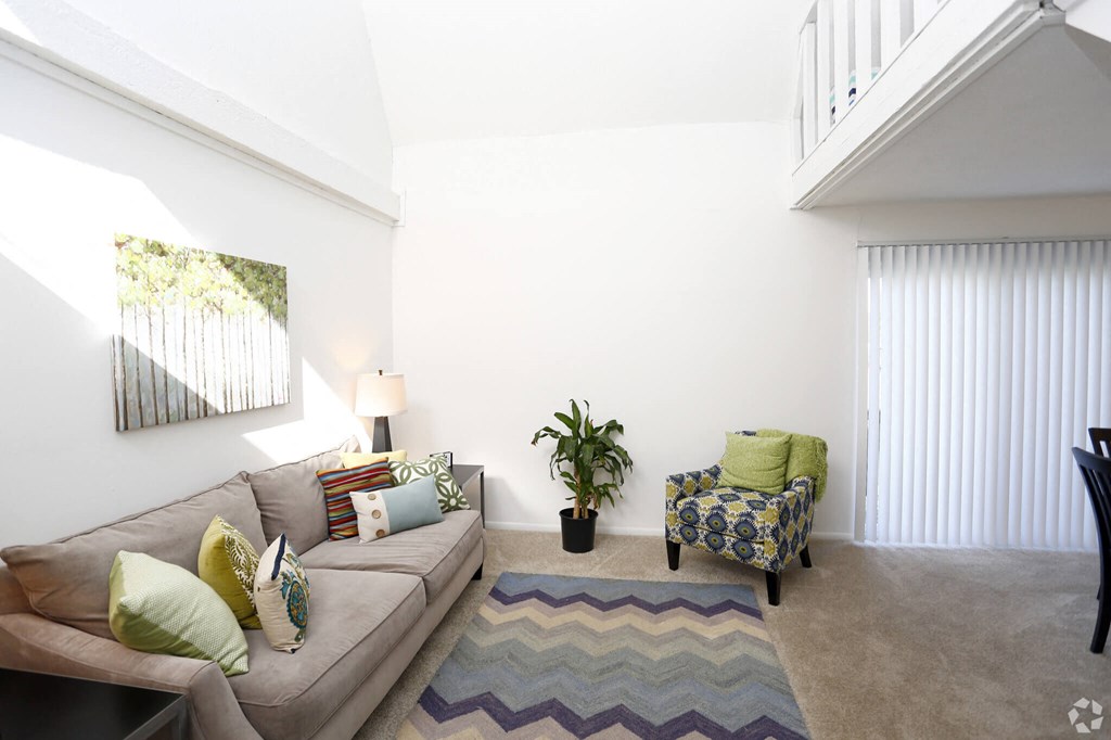 a living room with a couch and a chair