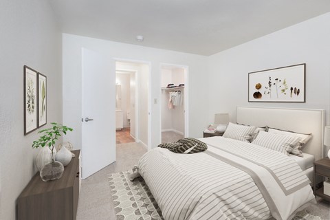 a bedroom with a bed and a dresser and a closet