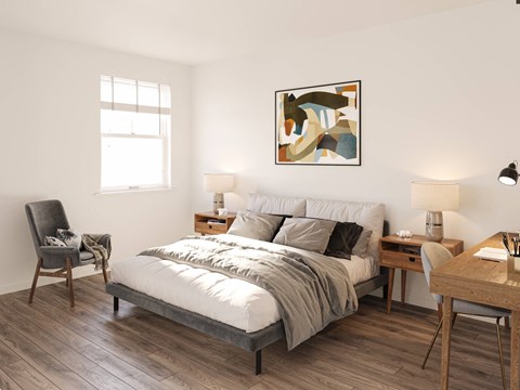 a bedroom with a bed and a desk and a window