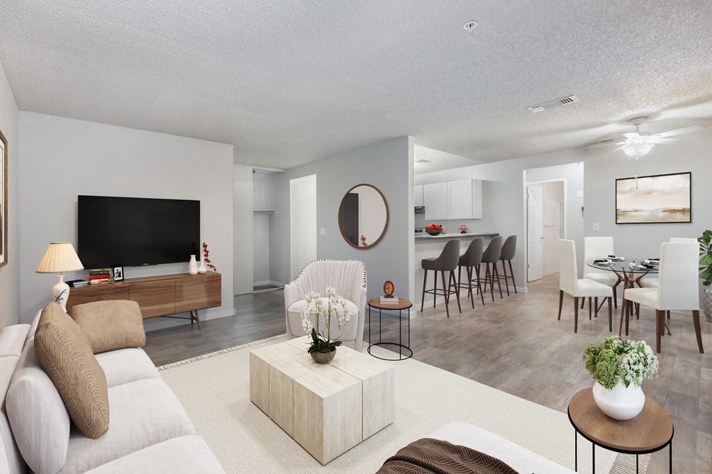 a living room and dining room with a couch and a table