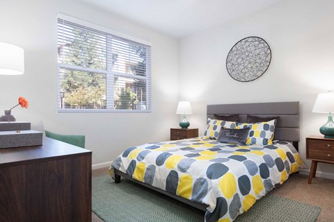 a bedroom with a bed and a window