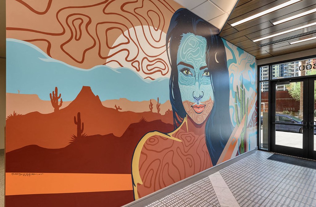 a mural of a woman on the side of a building