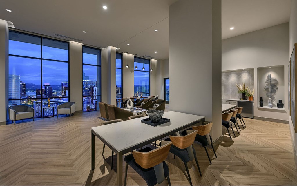 a dining room with a table and chairs