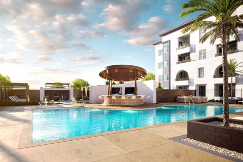 a swimming pool with a fountain in front of a building