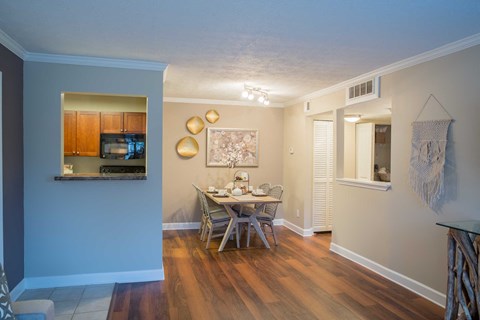 a dining room with a table and chairs