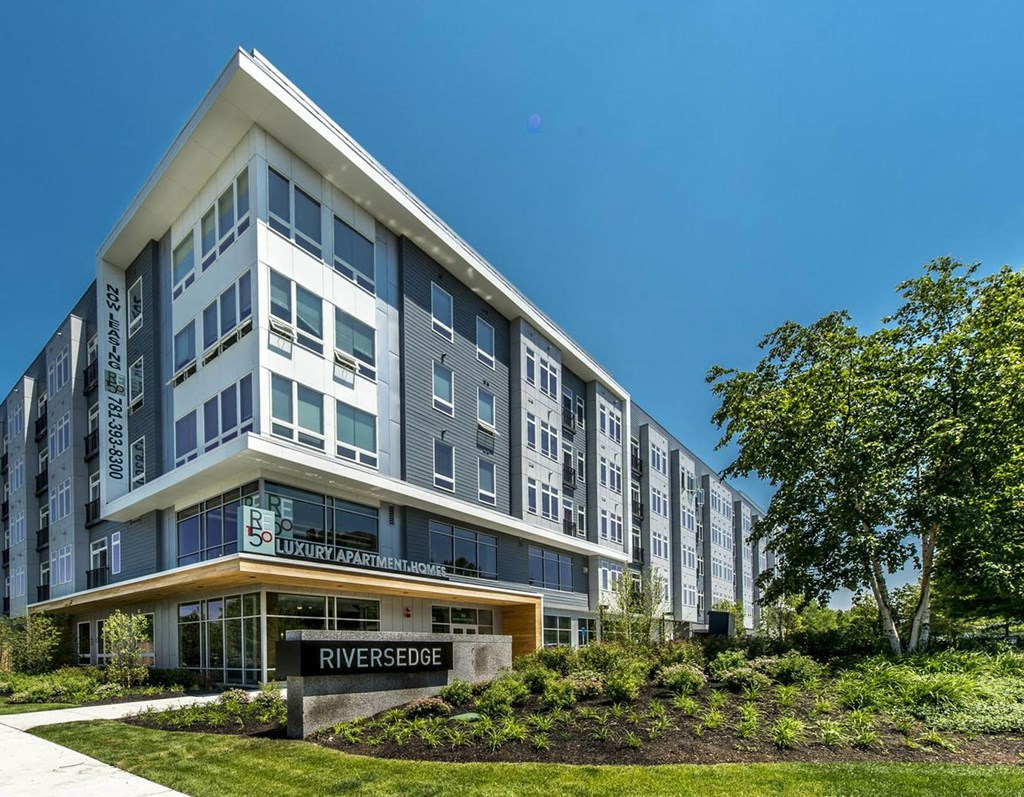 a building with a street sign in front of it