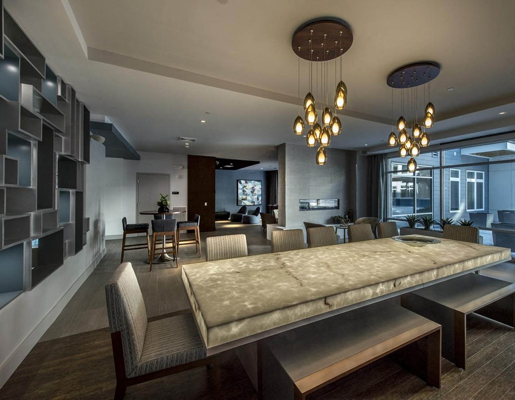 a large dining room with a table and chairs