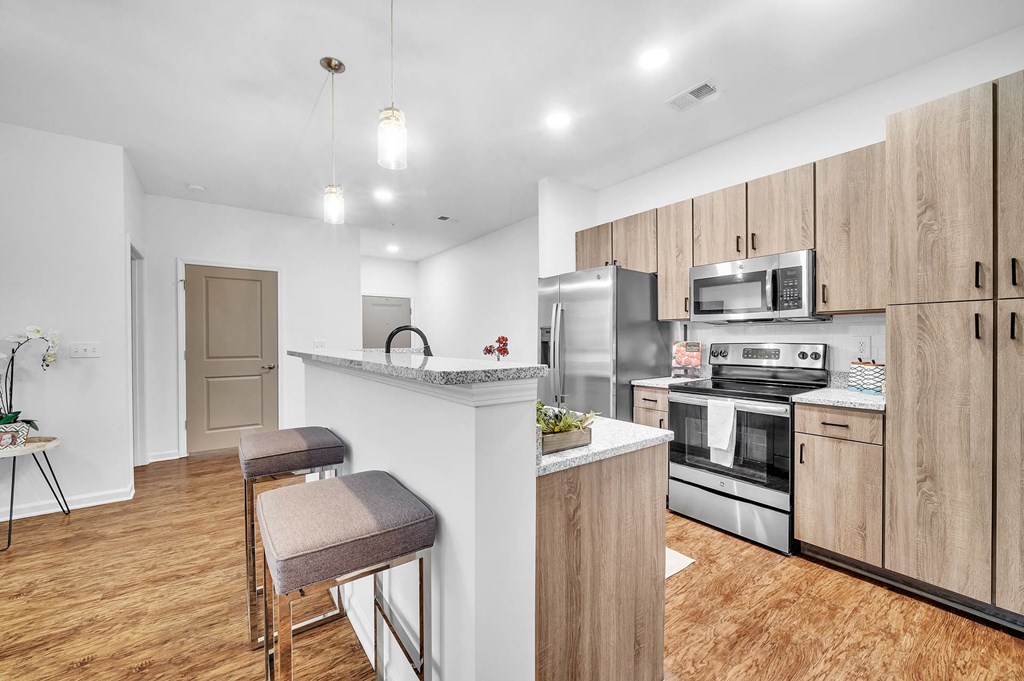 a kitchen with a counter top and a refrigerator