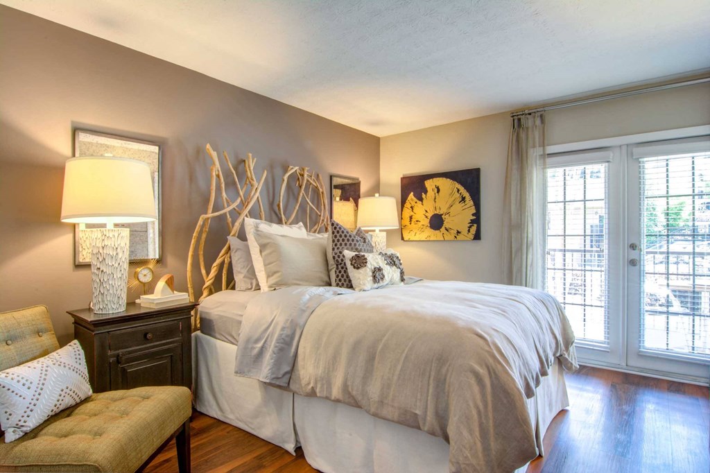 a bedroom with a large bed and a window