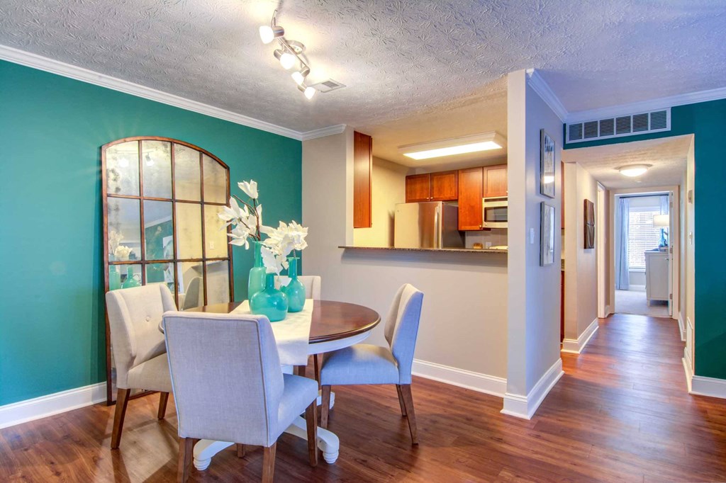 a dining room with a table and chairs
