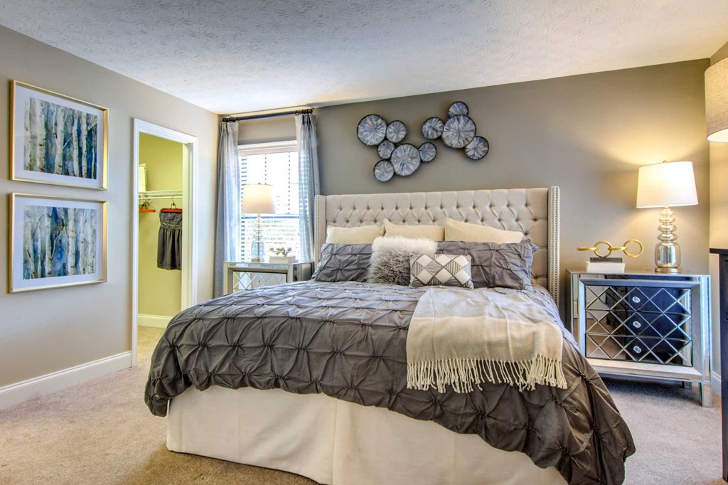 a bedroom with a bed and a closet