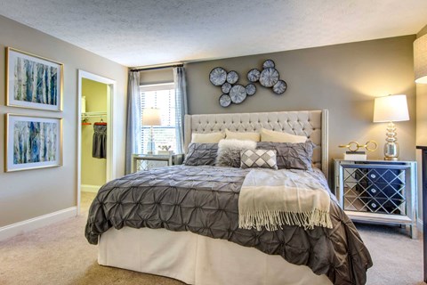 a bedroom with a bed and a closet