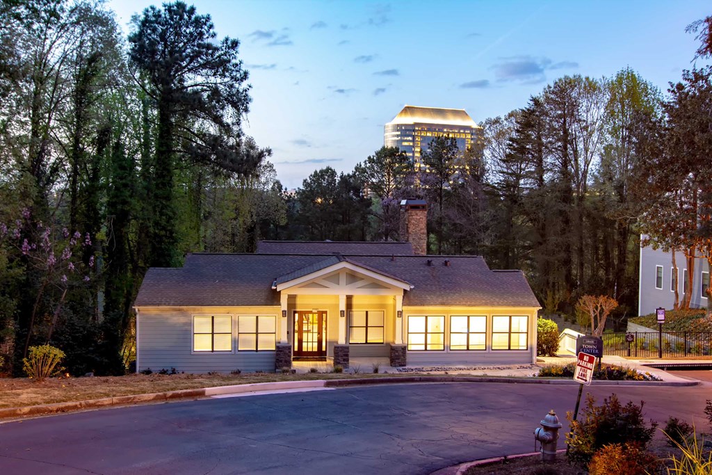 a home at dusk with a city in the background