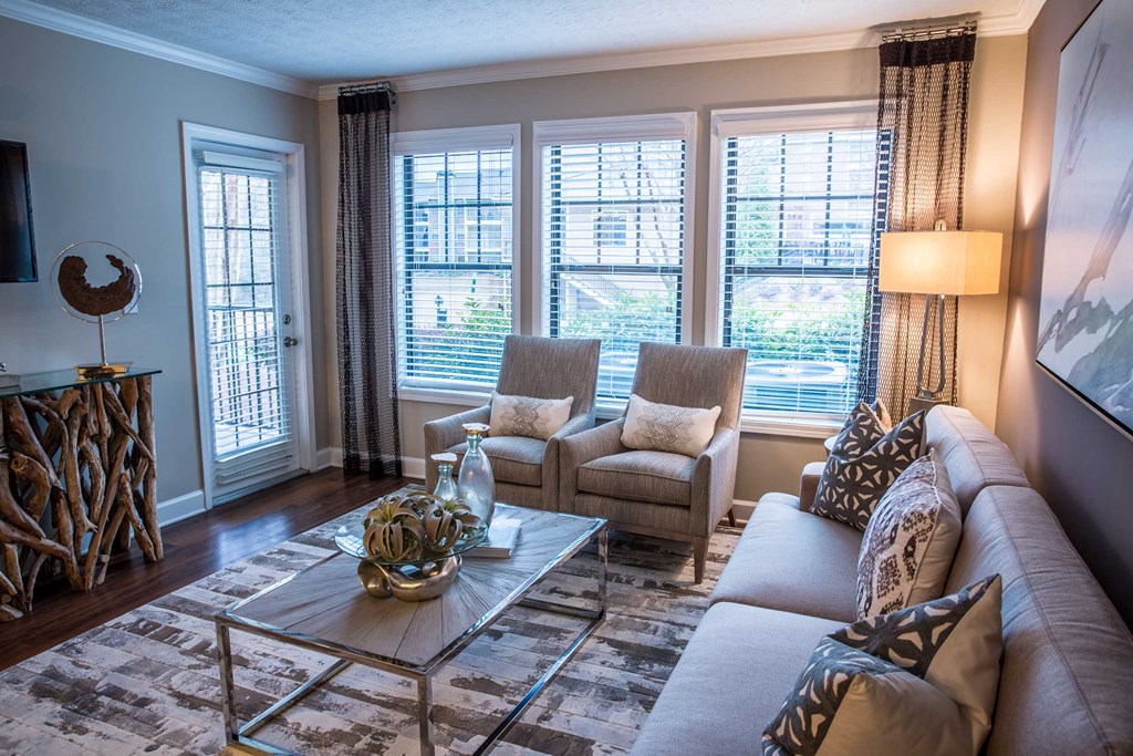 a living room with a couch and chairs