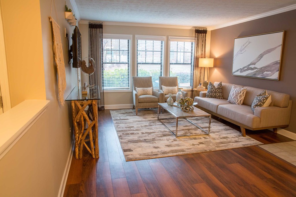 a view of a living room from the top of the stairs