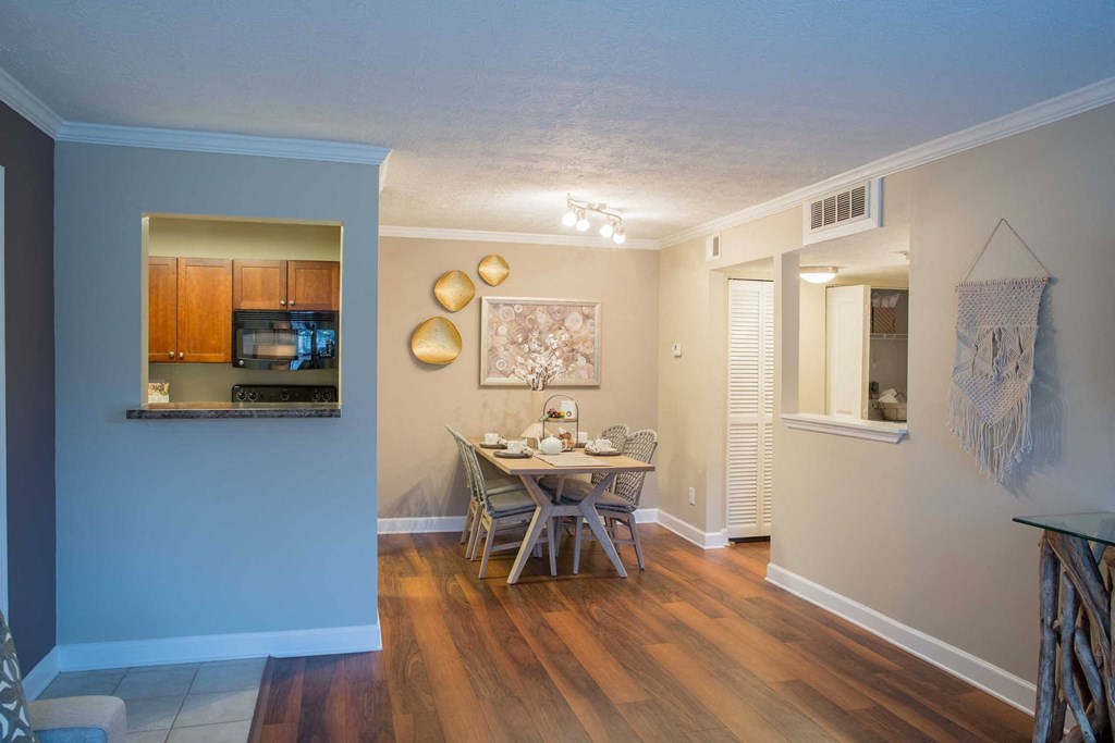 a dining room with a table and chairs