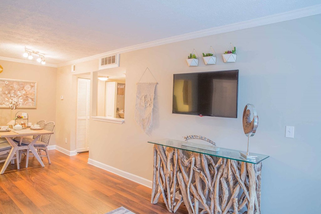 a living room with a tv and a table