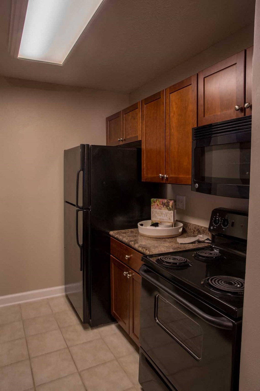 a kitchen with a stove and a refrigerator