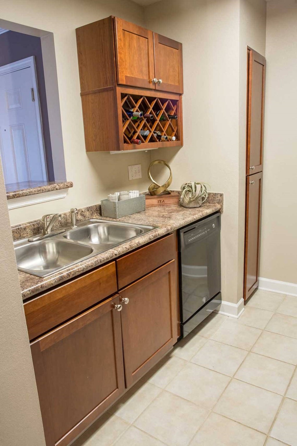 a kitchen with a sink and a dishwasher