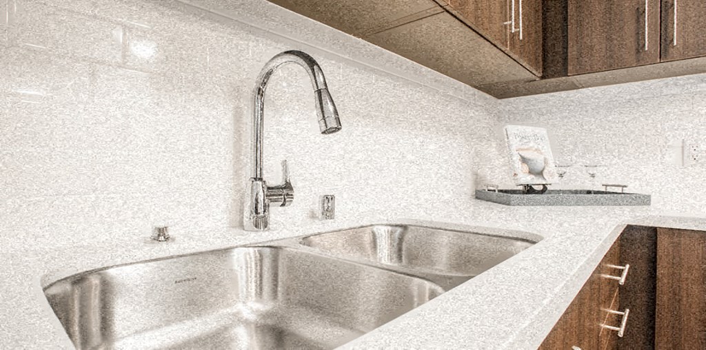 a kitchen with a sink and a faucet