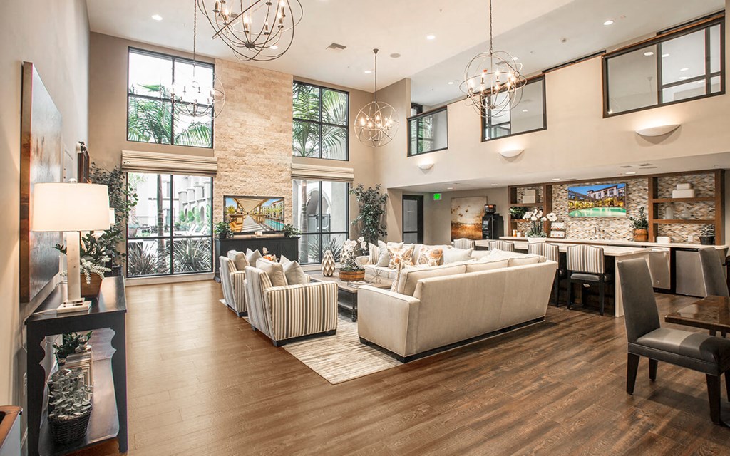 a living room with couches and chairs and a fireplace