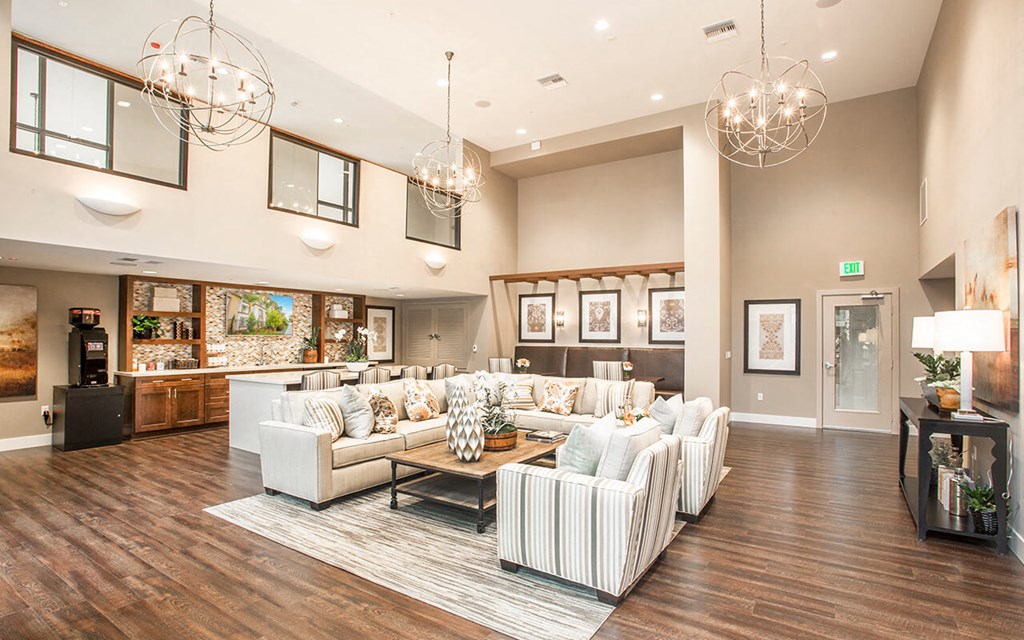 a large living room with couches and a table