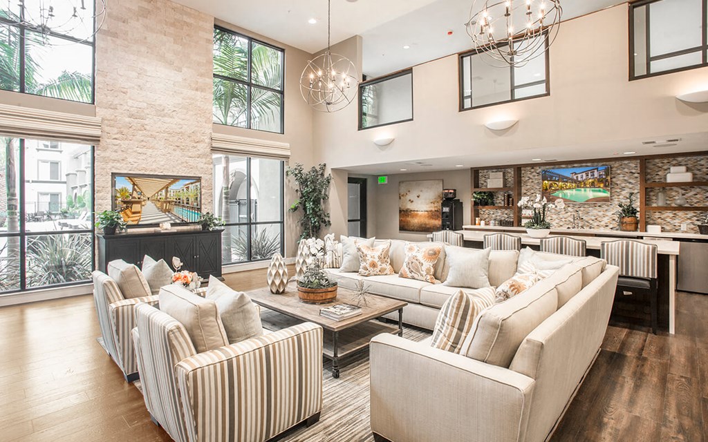 a living room with couches and chairs and a table