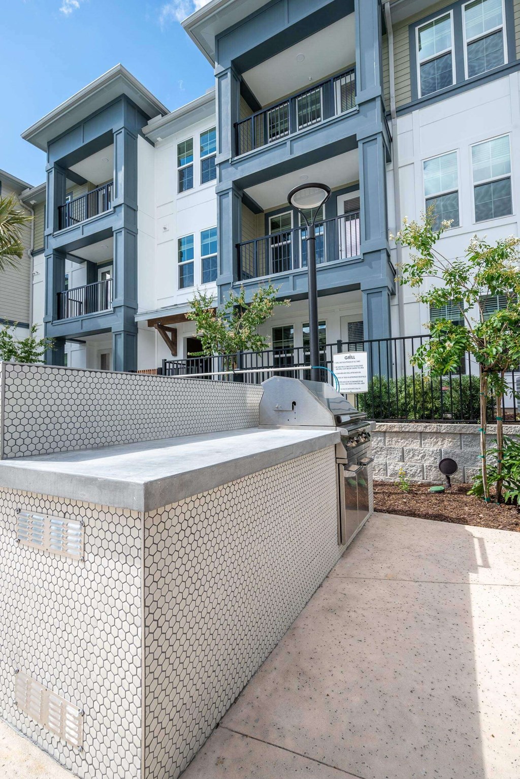 a large hot tub in front of an apartment building