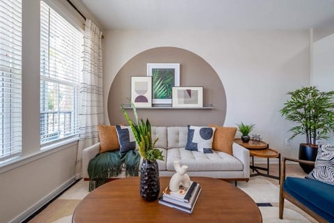 a living room with a couch and a table