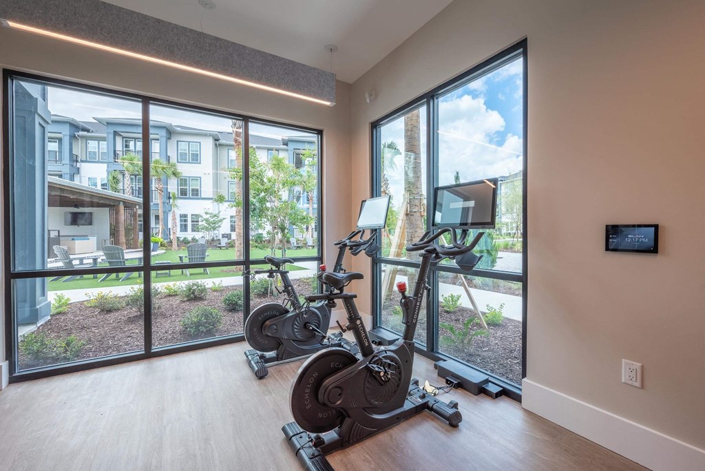 the residence apartments fitness room with exercise bikes