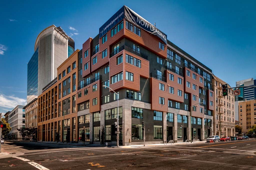 a large building on the corner of a city street